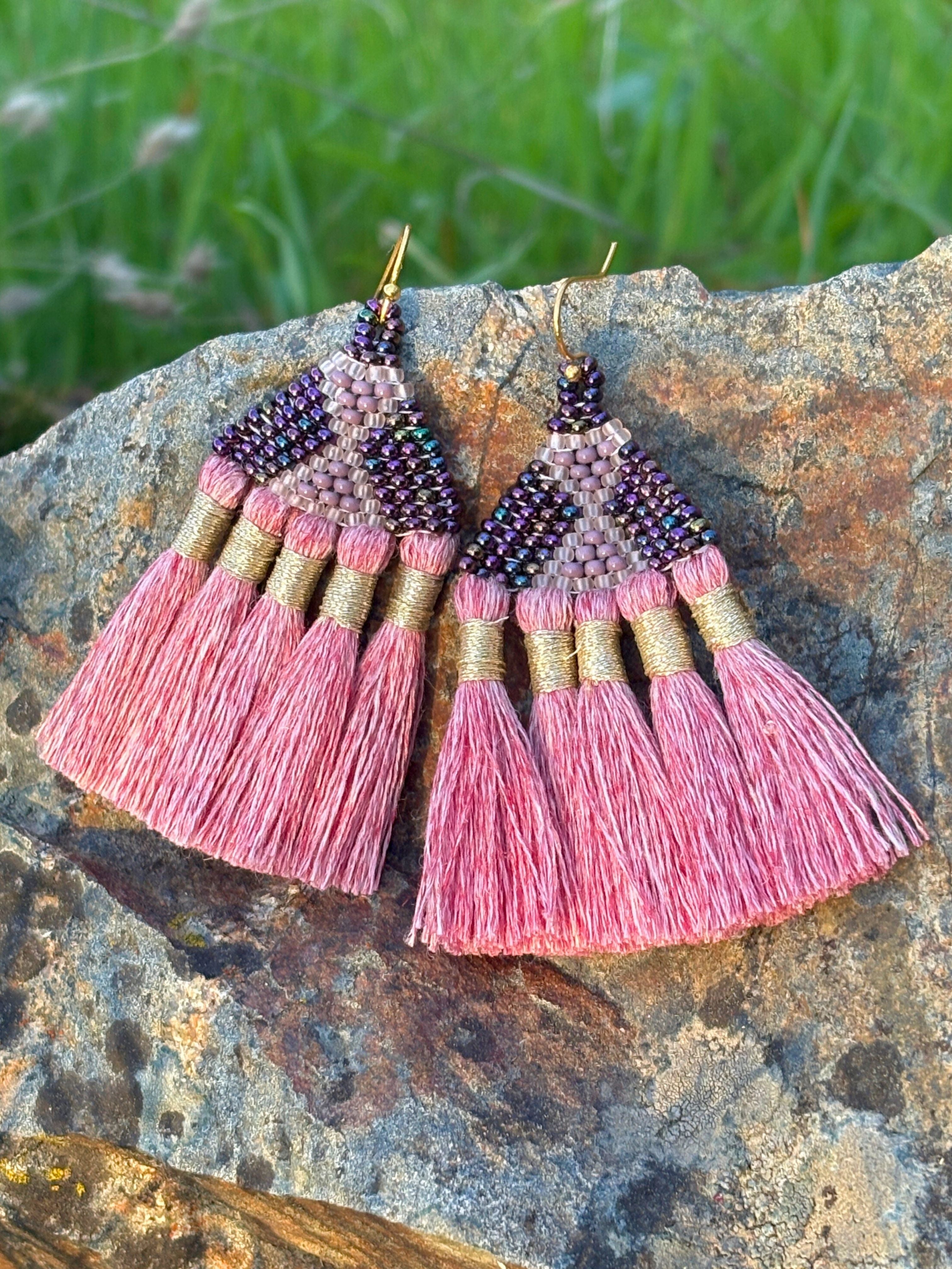 Pink tassel earrings with intricate beadwork and gold accents, handwoven design