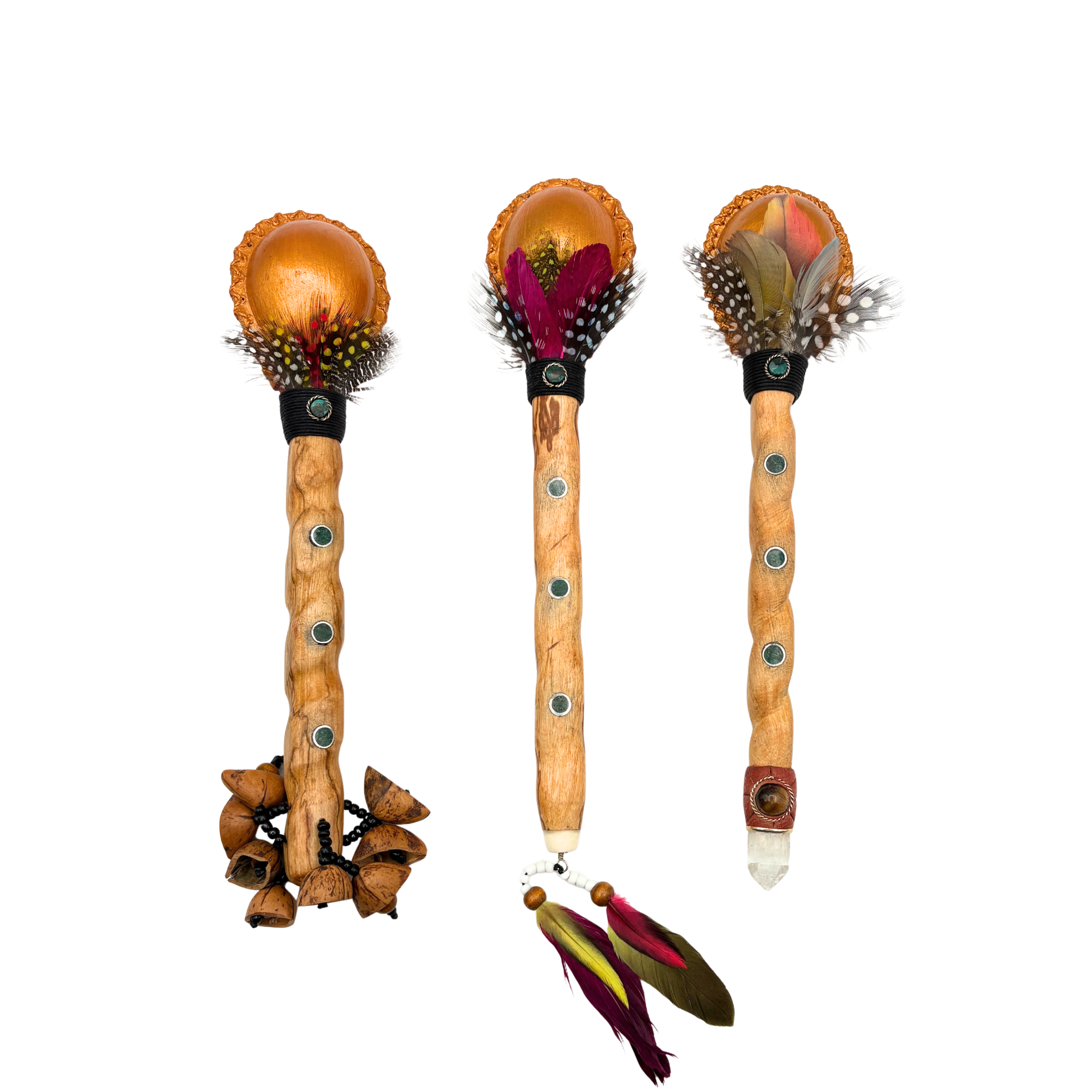 Handcrafted Maraca Royal made from Palo Santo wood, hand-painted in gold with variants featuring a seed rattle base, feather accents, or crystal adornment. Created by our Indigenous artisans in Peru, each maraca carries the sacred scent of Palo Santo and the spirit of ceremony and prayer.
