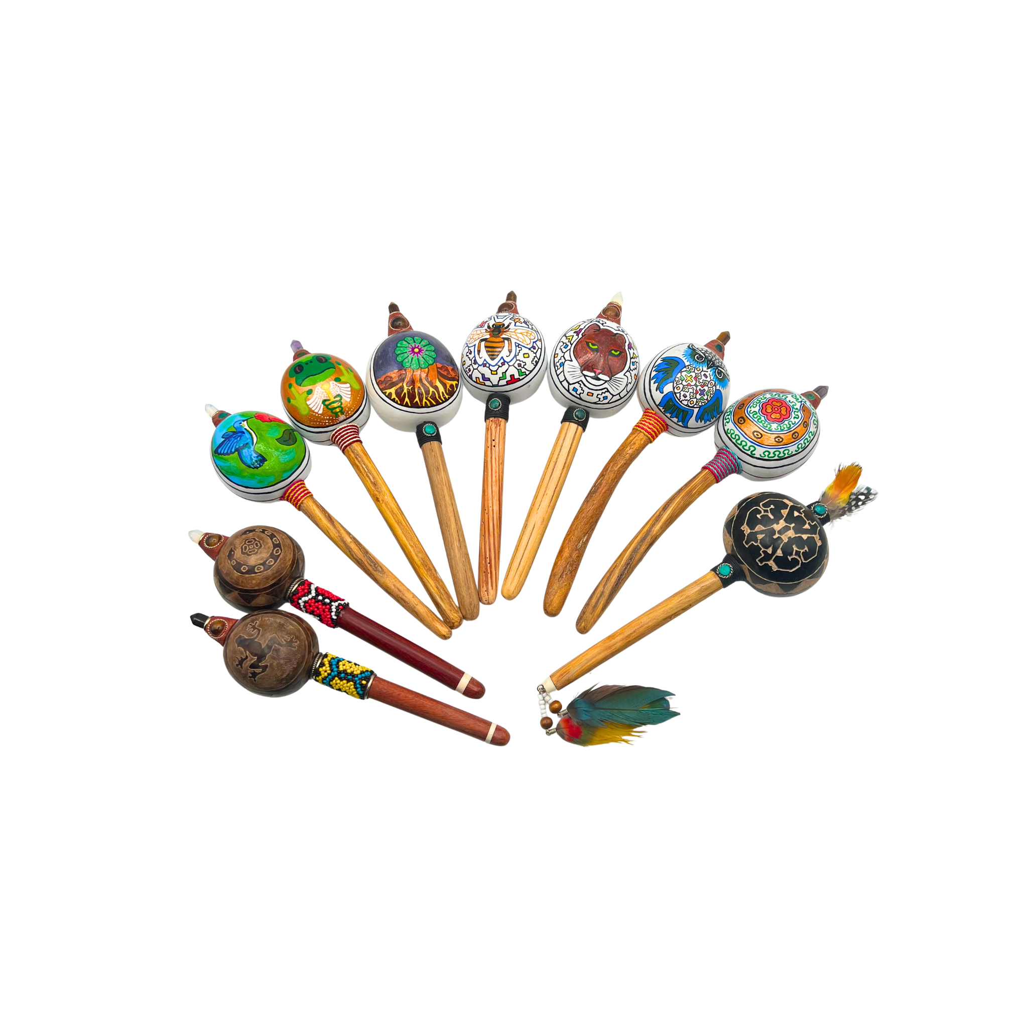 Handcrafted Maraca Wingo made from natural Amazonian gourd with a carved ayahuasca wood handle, chrysocolla, tiger’s eye, and amethyst gemstones. Available in painted or carved variants, each piece is handmade by the Shipibo collective in Peru as a sacred instrument for ceremony and sound healing.