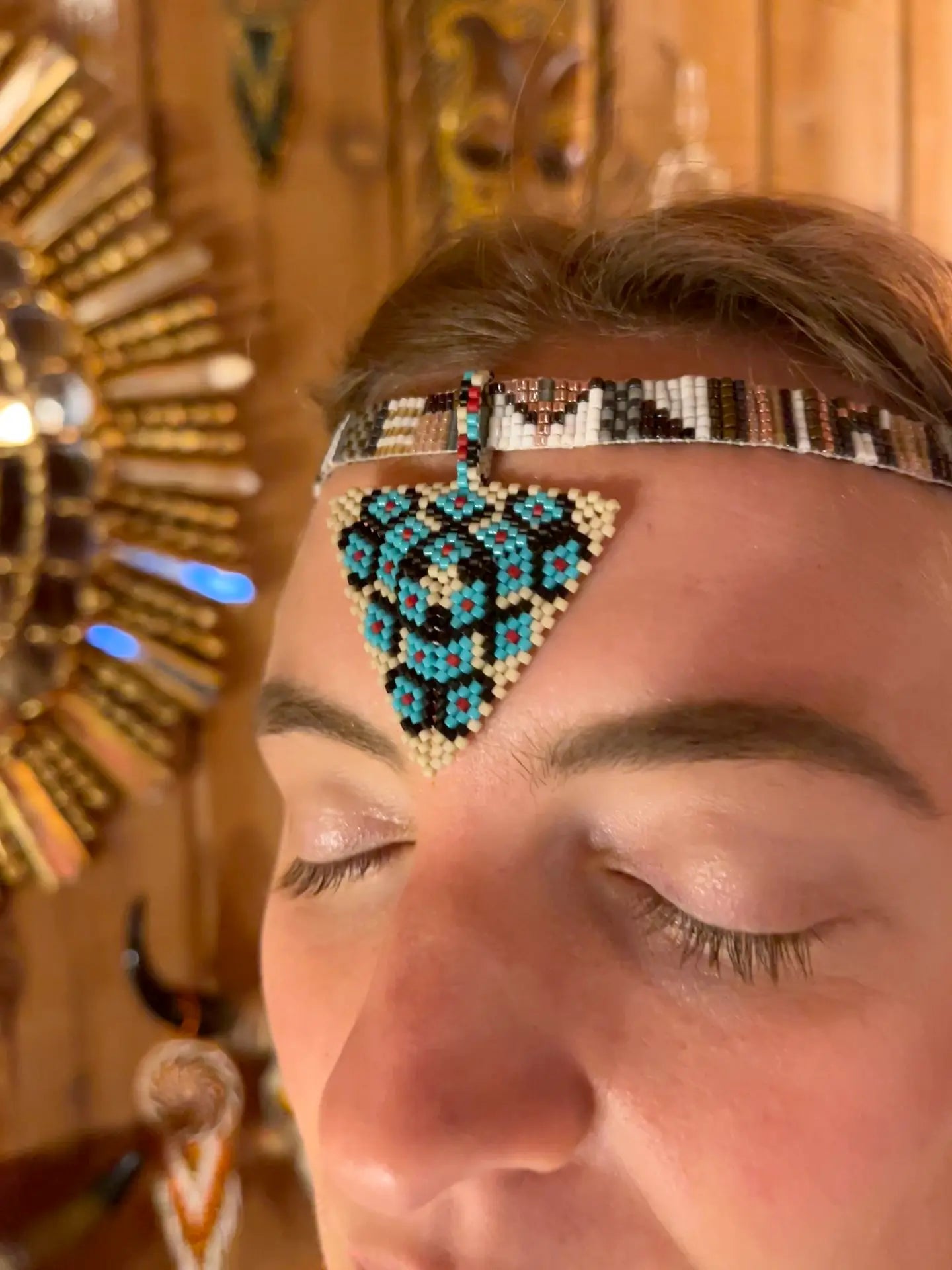 Model wearing Pyramid of the Third Eye Pendant handcrafted in Guatemala with Japanese Miyuki beadwork