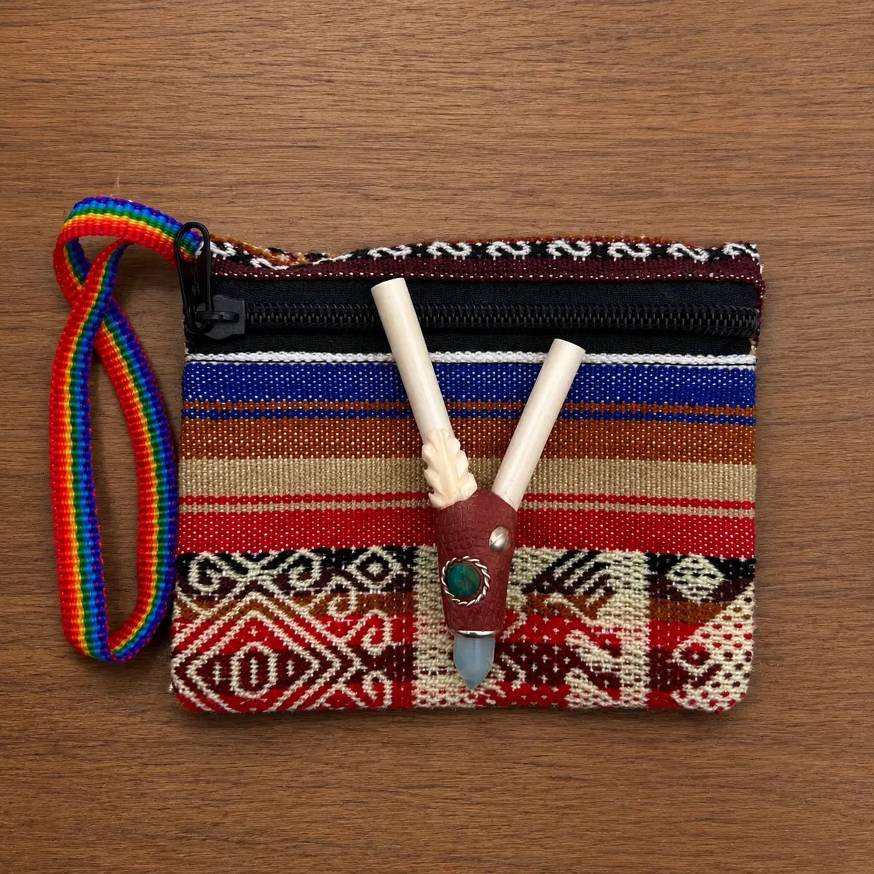 Handcrafted pelican bone crystal kuripe collection featuring moonstone and chrysocolla gemstone variants displayed on a woven pouch.