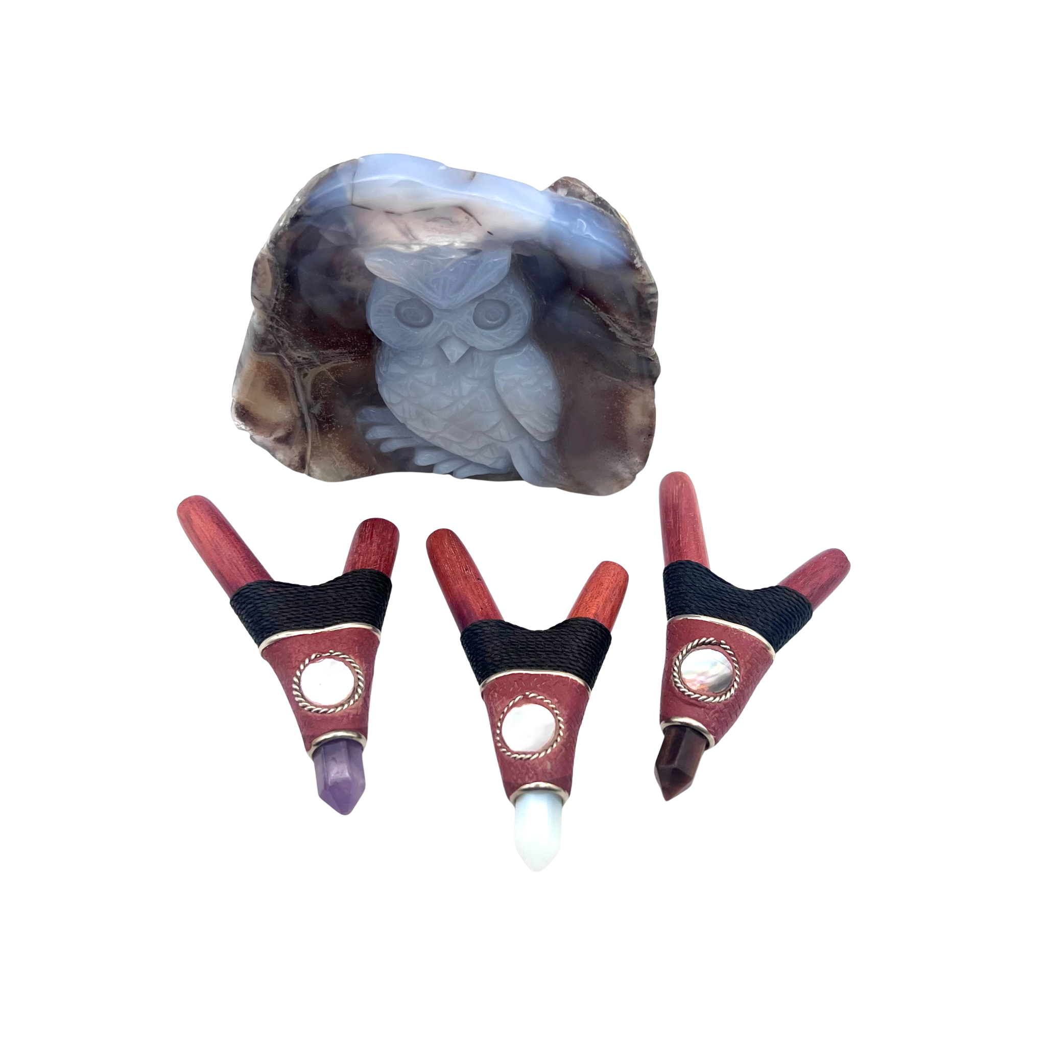 Three handcrafted Red Rocket Kuripes made from Amazonian wood with Amethyst, Moonstone, and Tiger’s Eye stones, displayed beside a carved owl geode — sacred tools for ceremony and grounding.