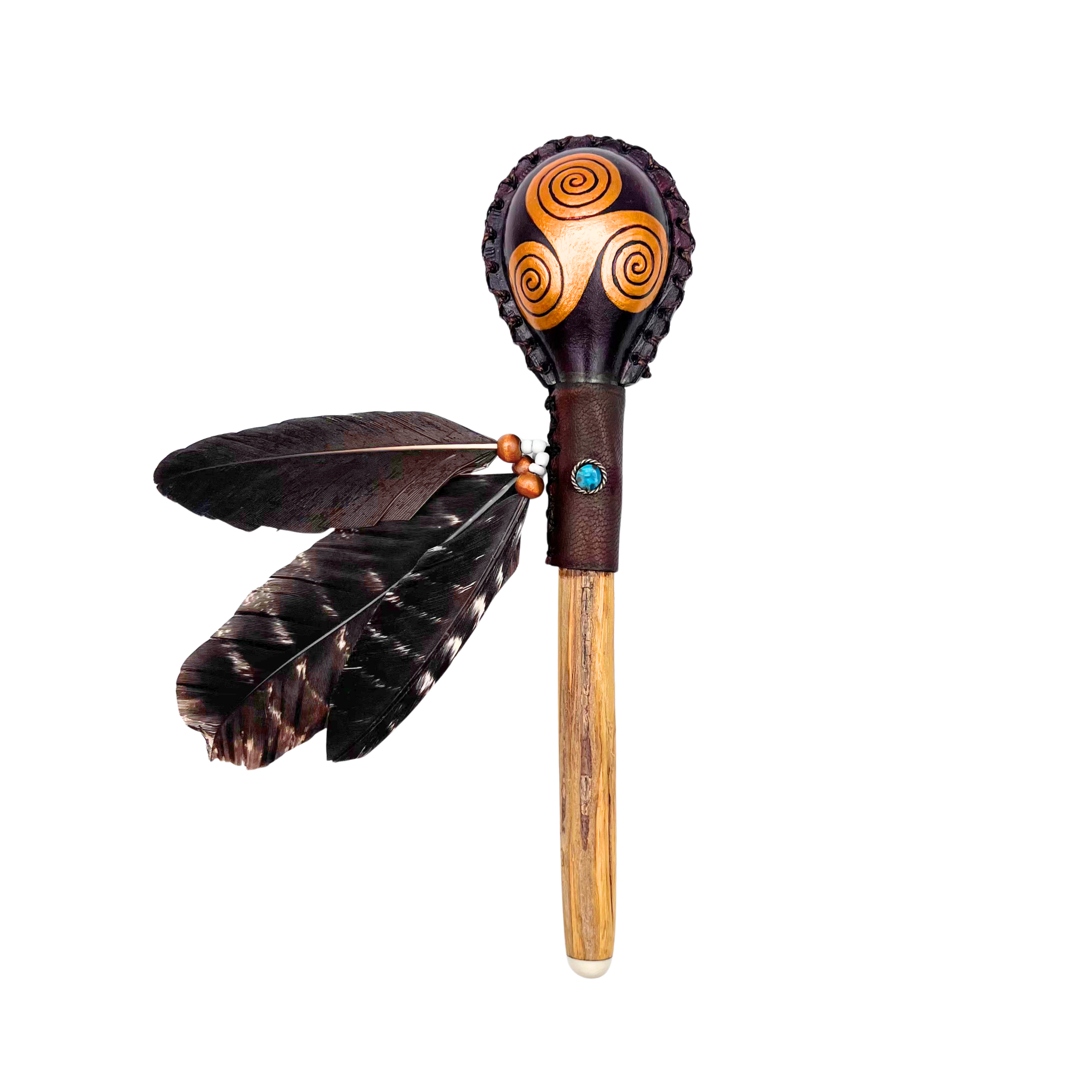 ndcrafted Shipibo maraca featuring a painted Celtic knot totem, adorned with feathers, leather-wrapped ayahuasca vine handle, and natural gemstone inlay. Sacred rattle handmade by Indigenous artisans of Peru, blending Amazonian and Celtic symbolism for ceremony, music, and spiritual harmony.